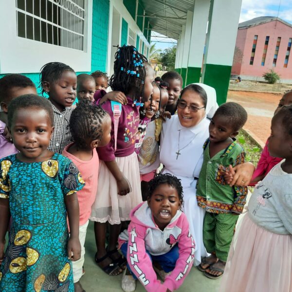 Augustinian Sister and students at completed school block. The school provides education and care for mothers participating in the farming livelihoods training. 